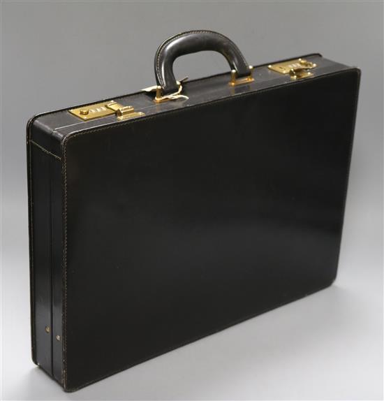 A black leather Gucci briefcase